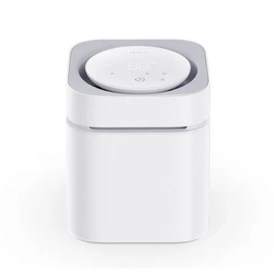 canvas dog crate set up in camper trailer next to sleeping greyhound